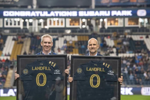 Alan Bethke, Subaru of America Inc.’s Senior Vice President - Marketing, and Tim McDermott, Philadelphia Union’s President, celebrate Subaru Park becoming the first soccer stadium in Major League Soccer to achieve zero landfill status on October 23, 2021.